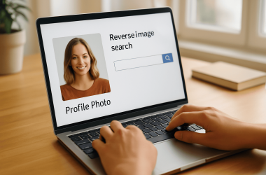 Hands on a laptop performing reverse image search on a profile photo for online dating safety.