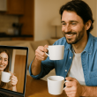Couple on a video call holding coffee mugs, symbolizing virtual connection in long-distance relationships.