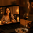 Couple smiling on video call while having a virtual dinner date